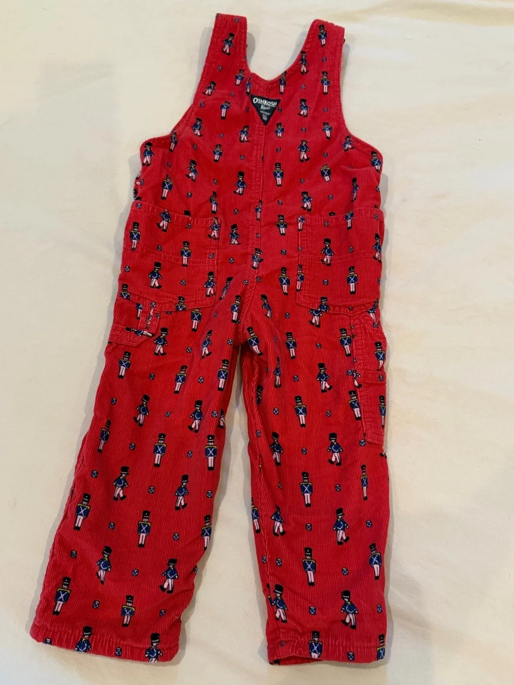 OshKosh B'gosh Red Corduroy Overalls with Toy Soldier Print